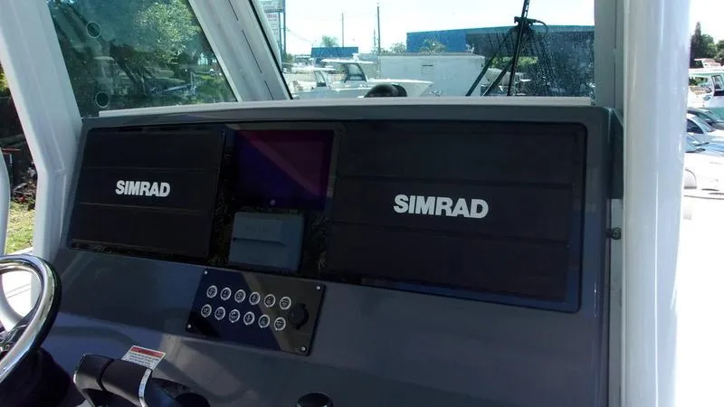  Yacht Photos Pics 2022 Crevalle 33 CSF Offshore Fishing boat dashboard with Simrad navigation system.