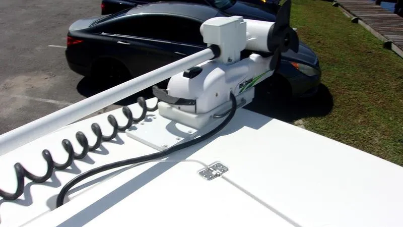  Yacht Photos Pics Crevalle 33 CSF Offshore Fishing boat, 2022 model, with trolling motor in parking lot.