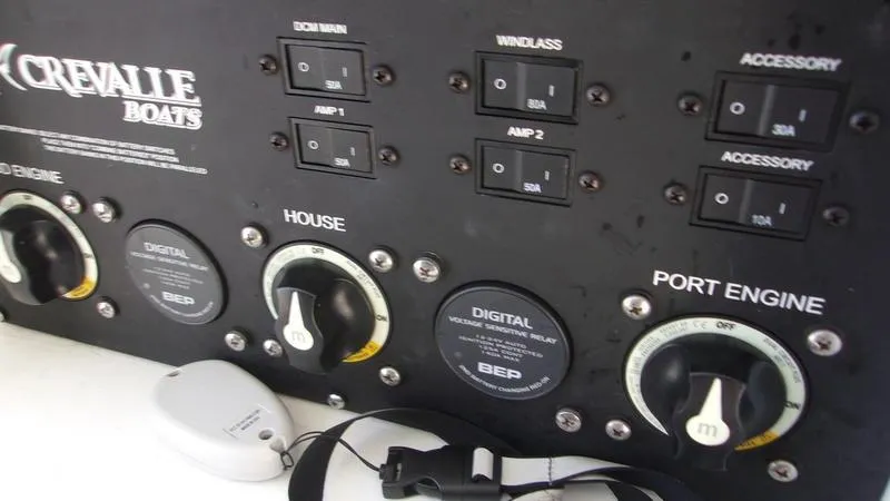  Yacht Photos Pics Control panel of 2022 Crevalle 33 CSF Offshore Fishing boat with switches and dials.