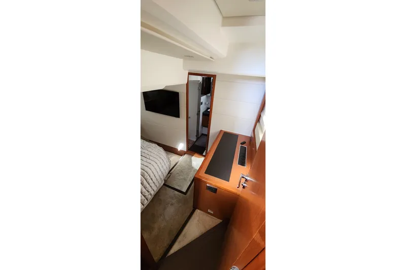  Yacht Photos Pics Interior of 2016 Jeanneau Prestige 50 yacht, featuring modern design and cozy cabin space.