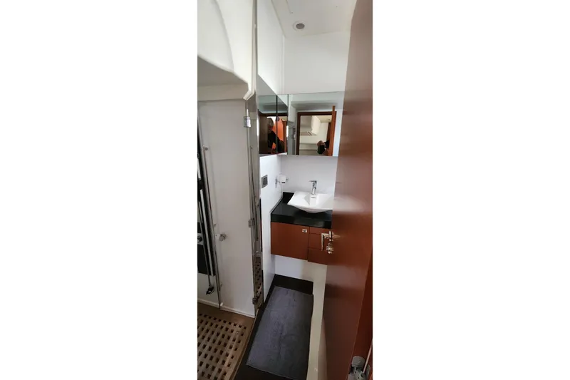  Yacht Photos Pics Luxurious bathroom interior of 2016 Jeanneau Prestige 50 yacht with modern fixtures.