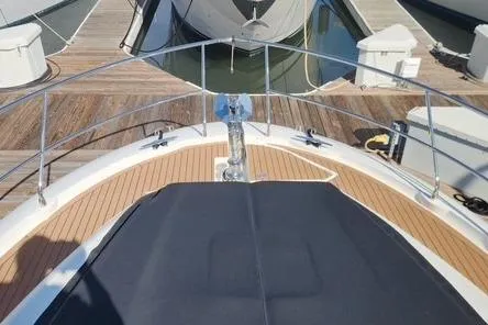  Yacht Photos Pics 2016 Jeanneau Prestige 50 yacht bow with teak deck and anchor at marina.