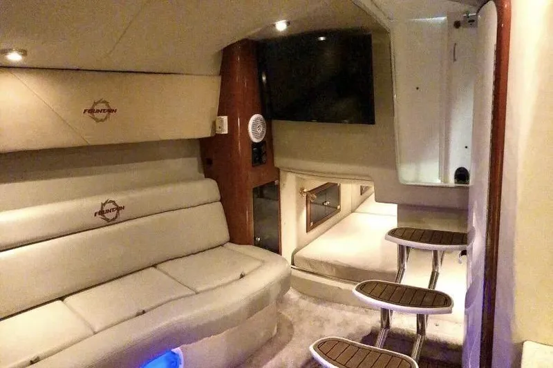  Yacht Photos Pics Luxurious interior of 2006 Fountain 38 Express Cruiser with plush seating and modern amenities.