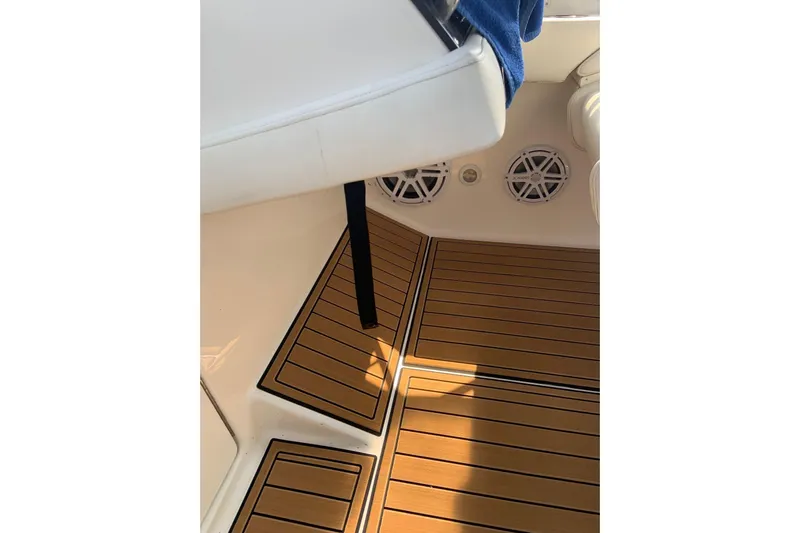  Yacht Photos Pics 2006 Fountain 38 Express Cruiser interior with teak flooring and speaker system.