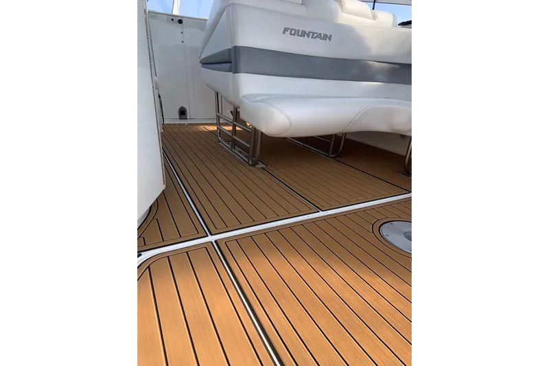  Yacht Photos Pics 2006 Fountain 38 Express Cruiser interior with teak flooring and white seating.