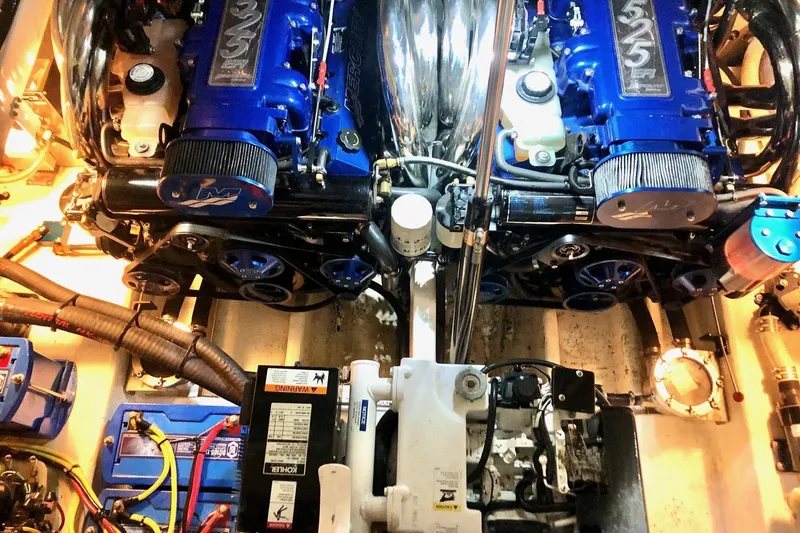  Yacht Photos Pics Engine room of a 2006 Fountain 38 Express Cruiser with dual blue engines.