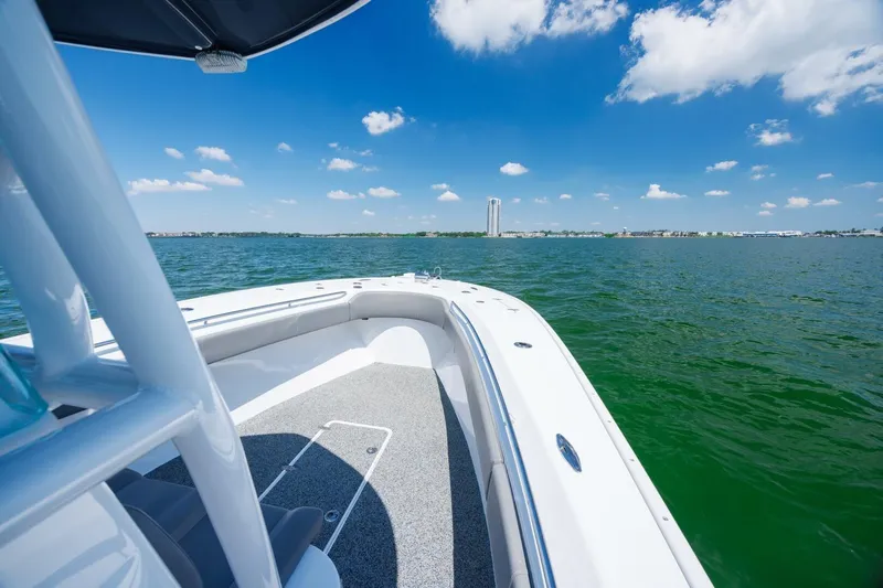  Yacht Photos Pics 2022 Cape Horn 31 T boat on calm water under a clear blue sky.