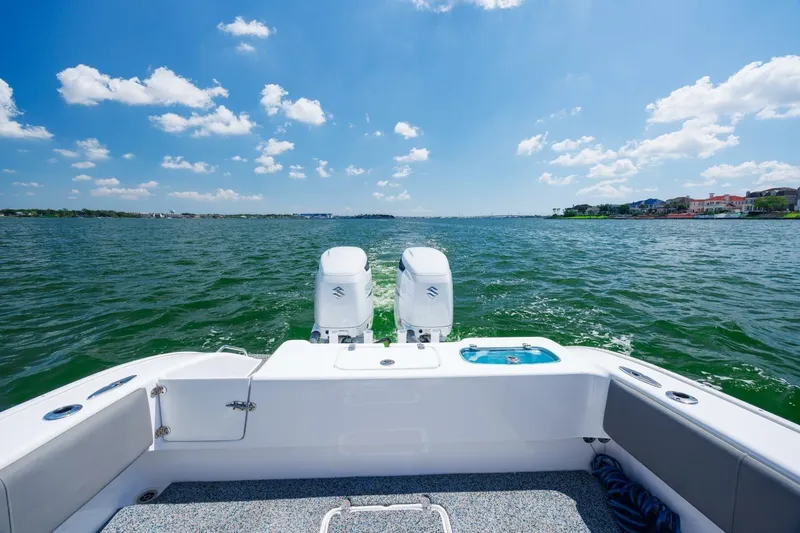  Yacht Photos Pics 2022 Cape Horn 31 T boat on open water, featuring dual engines and clear blue skies.