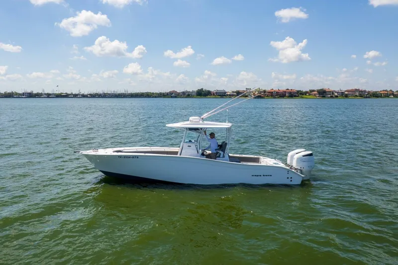  Yacht Photos Pics 2022 Cape Horn 31 T boat on calm water under a clear blue sky.
