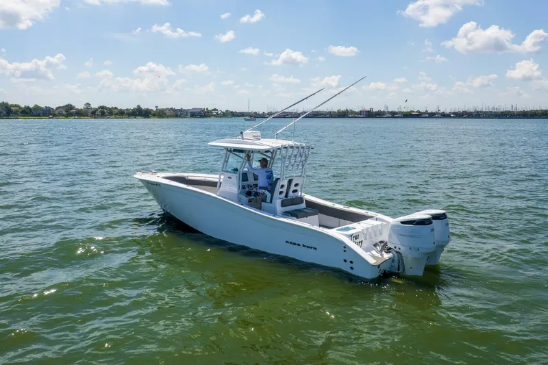  Yacht Photos Pics 2022 Cape Horn 31 T boat on calm water under a clear sky.