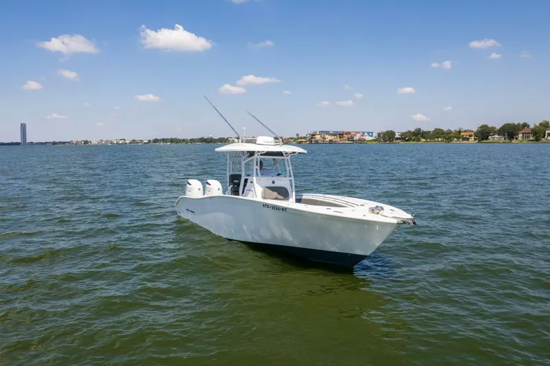  Yacht Photos Pics 2022 Cape Horn 31 T boat on calm water under a clear blue sky.