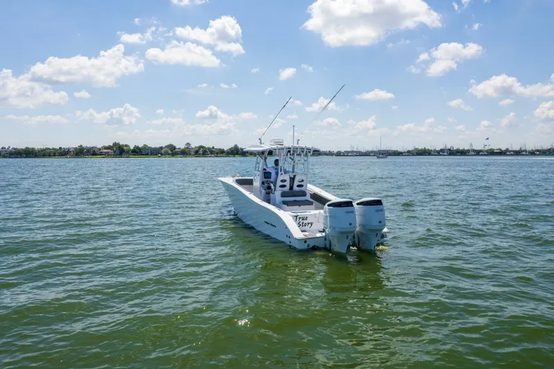  Yacht Photos Pics 2022 Cape Horn 31 T boat on calm water under a clear sky.