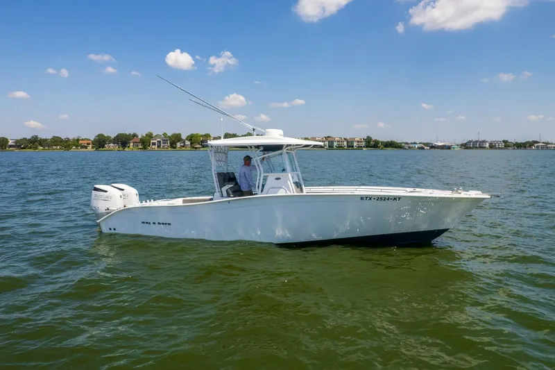  Yacht Photos Pics 2022 Cape Horn 31 T boat on calm water, clear sky background.
