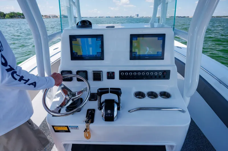  Yacht Photos Pics Cockpit of 2022 Cape Horn 31 T boat with dual navigation screens and steering wheel.