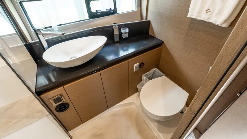  Yacht Photos Pics Modern bathroom in 2022 Prestige 460 Fly yacht with sleek sink and toilet.