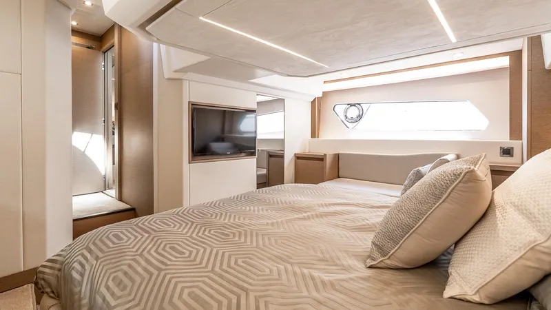  Yacht Photos Pics Luxurious bedroom interior of 2022 Prestige 460 Fly yacht with modern design and elegant decor.