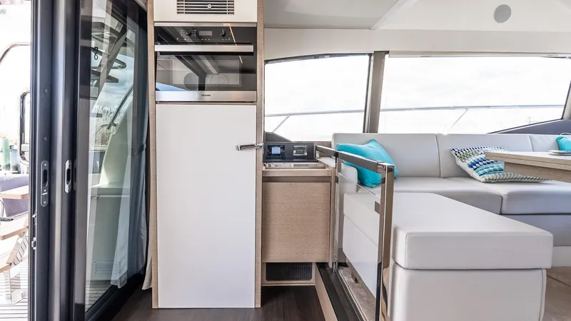  Yacht Photos Pics Luxurious interior of 2022 Prestige 460 Fly yacht with modern seating and amenities.