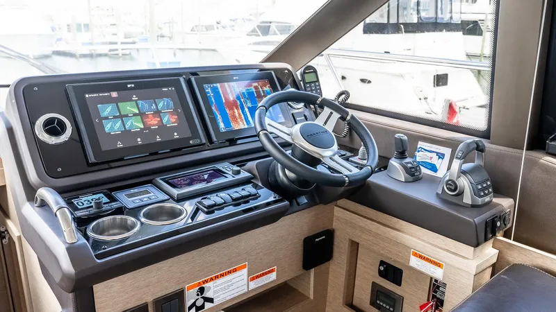  Yacht Photos Pics Helm of 2022 Prestige 460 Fly yacht with advanced navigation controls and displays.