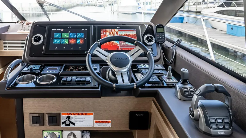  Yacht Photos Pics Helm of 2022 Prestige 460 Fly yacht with advanced navigation controls and displays.