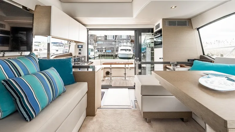  Yacht Photos Pics Luxurious interior of 2022 Prestige 460 Fly yacht with modern seating and elegant decor.