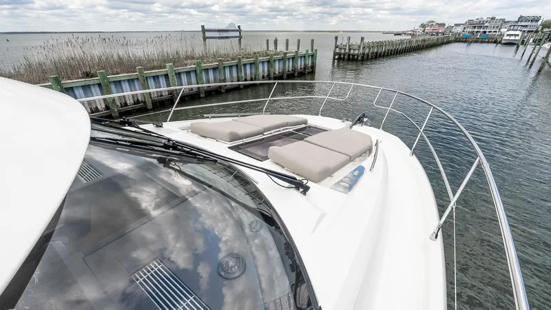  Yacht Photos Pics Prestige 460 Fly 2022 yacht on calm waters, showcasing sleek design and luxurious deck.