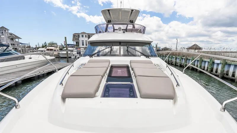  Yacht Photos Pics Prestige 460 Fly 2022 yacht docked, featuring spacious sunbathing area and sleek design.