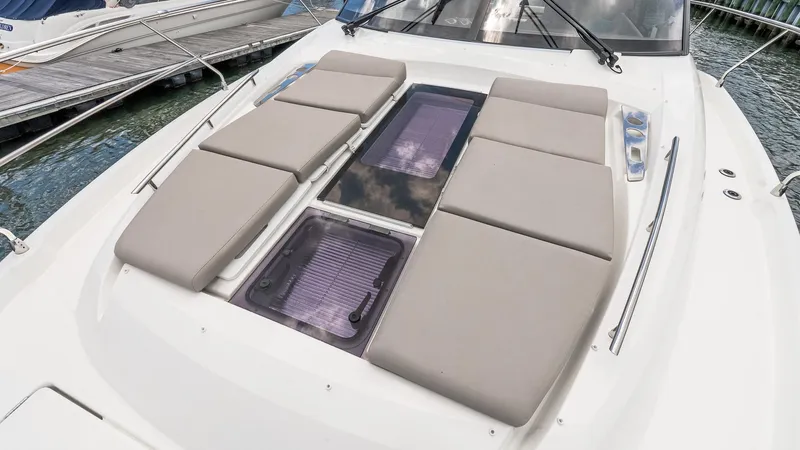  Yacht Photos Pics Prestige 460 Fly 2022 yacht with cushioned sunbathing area on deck.