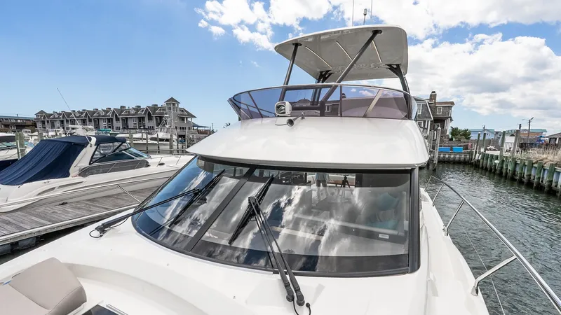  Yacht Photos Pics 2022 Prestige 460 Fly yacht docked at marina, showcasing sleek design and modern features.