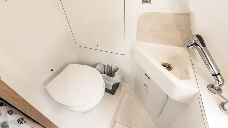  Yacht Photos Pics Compact bathroom in 2022 Prestige 460 Fly yacht with toilet and sink.