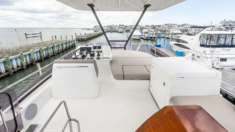  Yacht Photos Pics Flybridge view of 2022 Prestige 460 Fly yacht docked at marina.