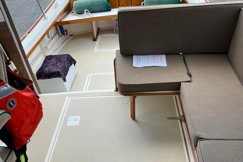 Dulce Yacht Photos Pics Interior of a 2003 Dyer 29 Soft Top boat with seating and life jacket.