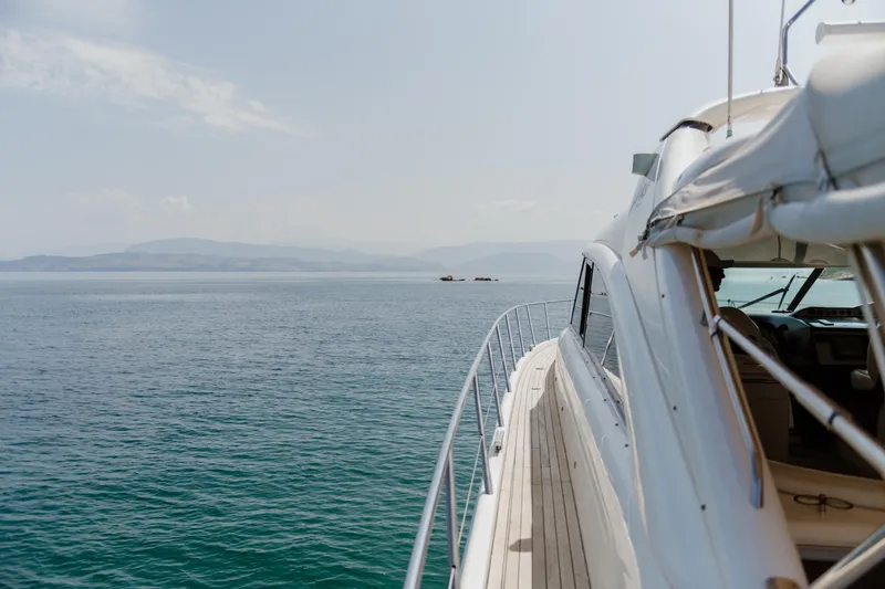 Princess V65 Yacht Photos Pics Luxury yacht Princess V65 cruising on open sea, 2003 model.