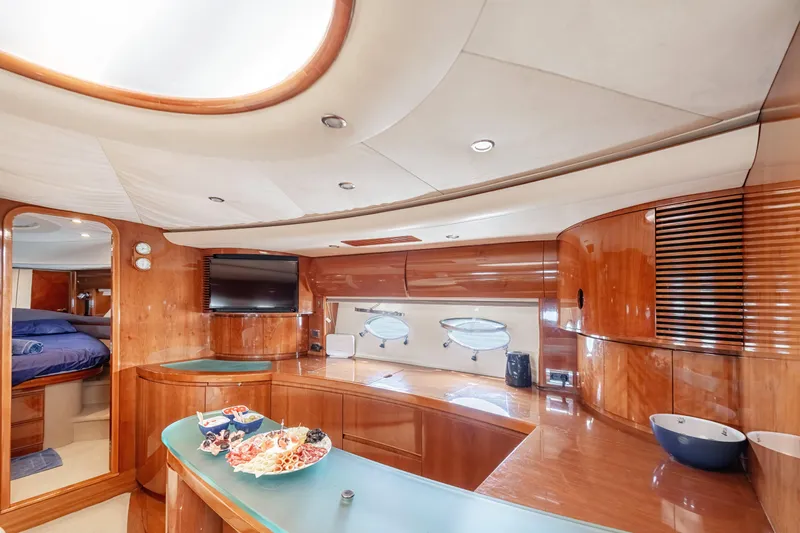 Princess V65 Yacht Photos Pics Luxurious interior of 2003 Princess V65 yacht with modern amenities and elegant wood finishes.