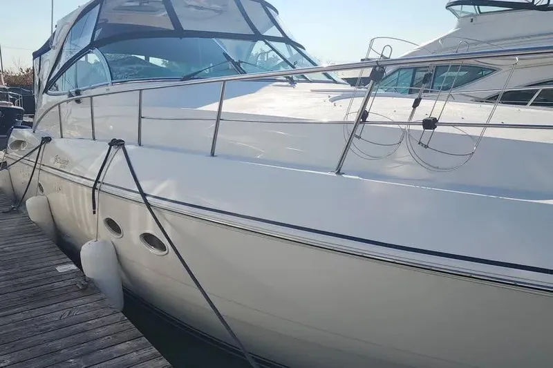  Yacht Photos Pics 2005 Cruisers Yachts 440 Express docked, showcasing sleek design and modern features.