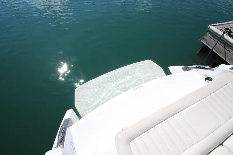  Yacht Photos Pics 2016 Cobalt R30 boat with sunlit swim platform on calm water.