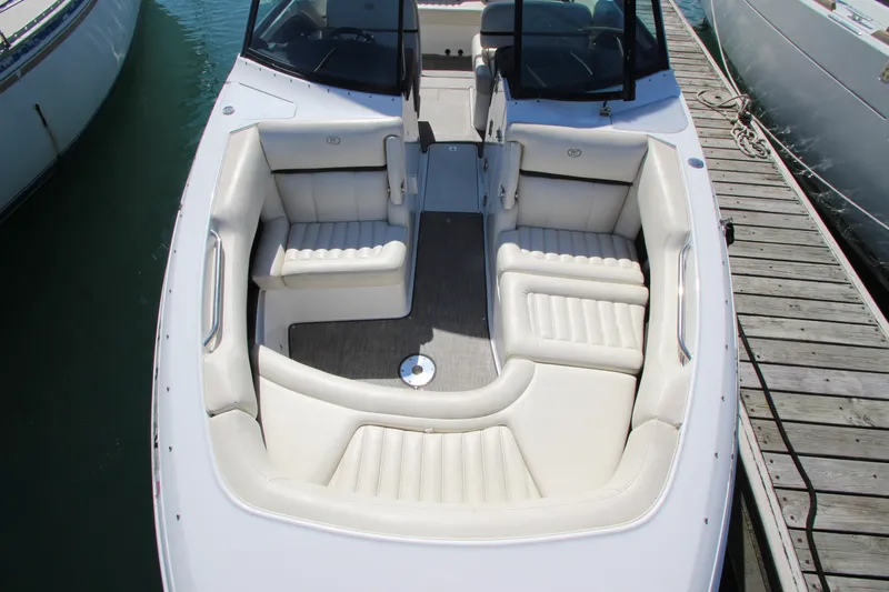  Yacht Photos Pics 2016 Cobalt R30 boat with spacious white seating, docked at marina.