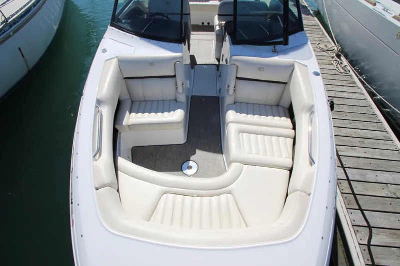  Yacht Photos Pics 2016 Cobalt R30 boat with spacious white seating, docked at marina.