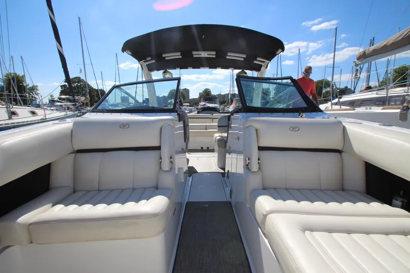  Yacht Photos Pics 2016 Cobalt R30 boat interior with white seating and open deck, docked at marina.