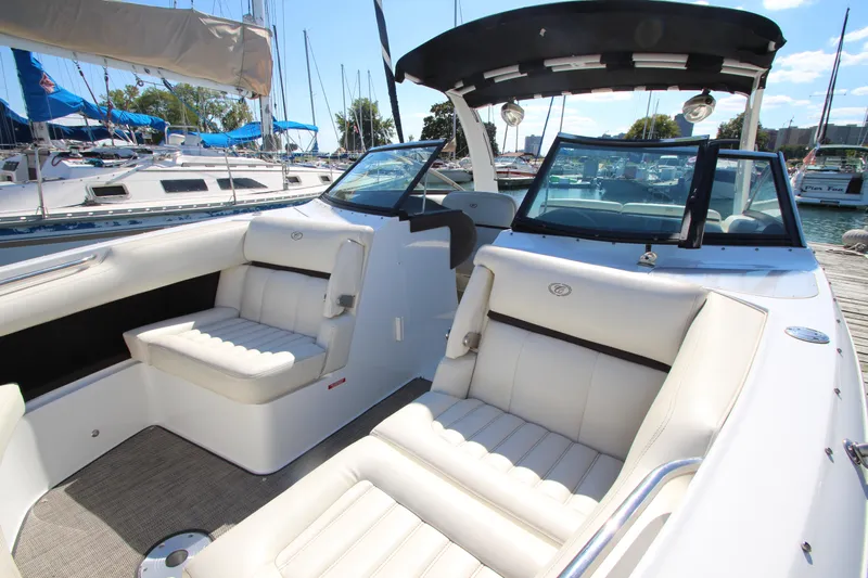  Yacht Photos Pics 2016 Cobalt R30 boat interior with white seating, docked at a marina.