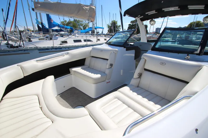  Yacht Photos Pics 2016 Cobalt R30 boat interior with white seating, docked at marina.