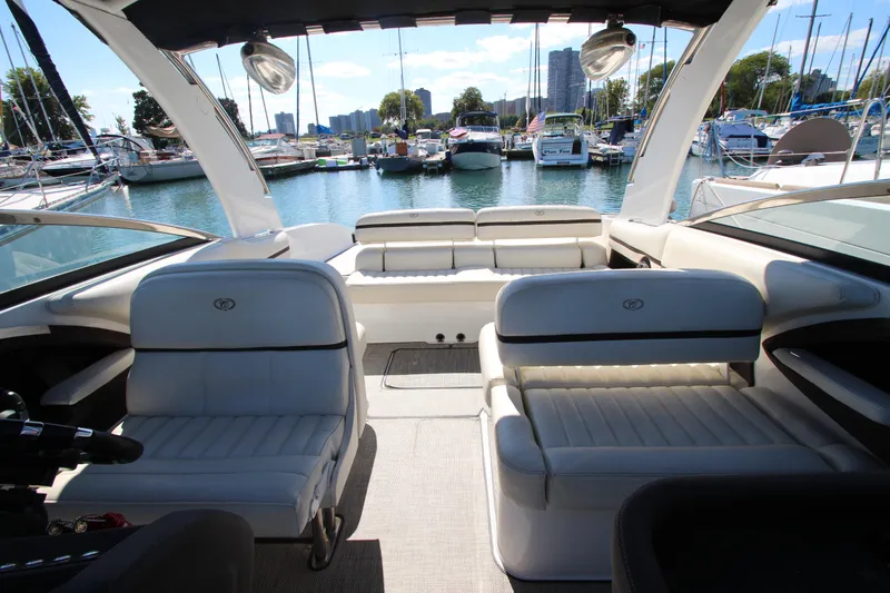  Yacht Photos Pics 2016 Cobalt R30 boat interior with white seating, docked in a marina.