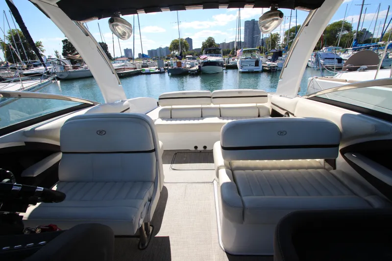  Yacht Photos Pics Luxurious 2016 Cobalt R30 boat interior with white seating, docked at a marina.