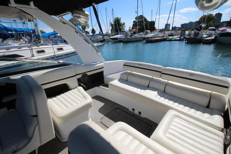  Yacht Photos Pics Luxurious 2016 Cobalt R30 boat interior with white seating, docked at a marina.