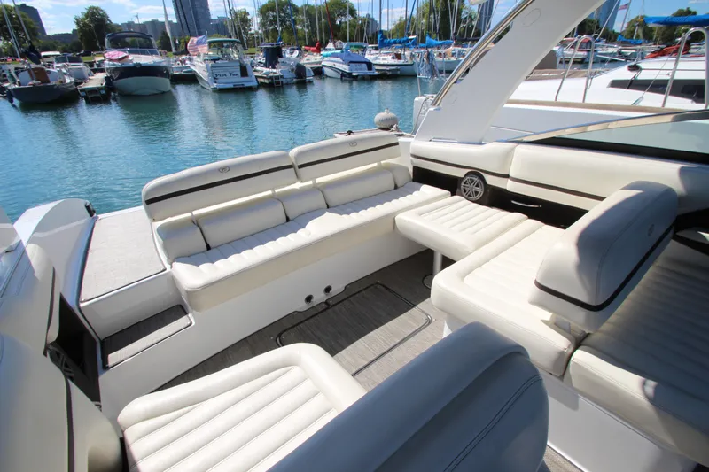  Yacht Photos Pics 2016 Cobalt R30 boat interior with white seating, docked in a marina.