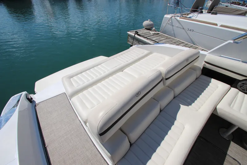  Yacht Photos Pics 2016 Cobalt R30 boat with luxurious white seating on a sunny day by the water.