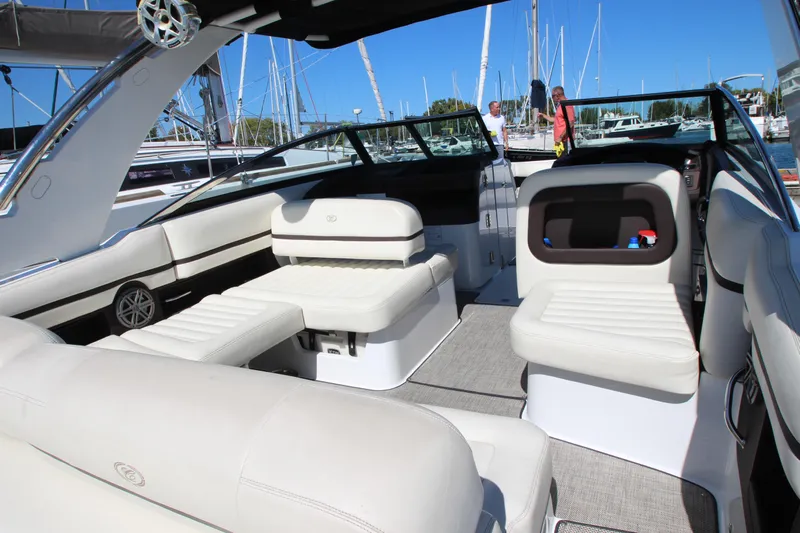  Yacht Photos Pics 2016 Cobalt R30 boat interior with white seating, docked at a marina.