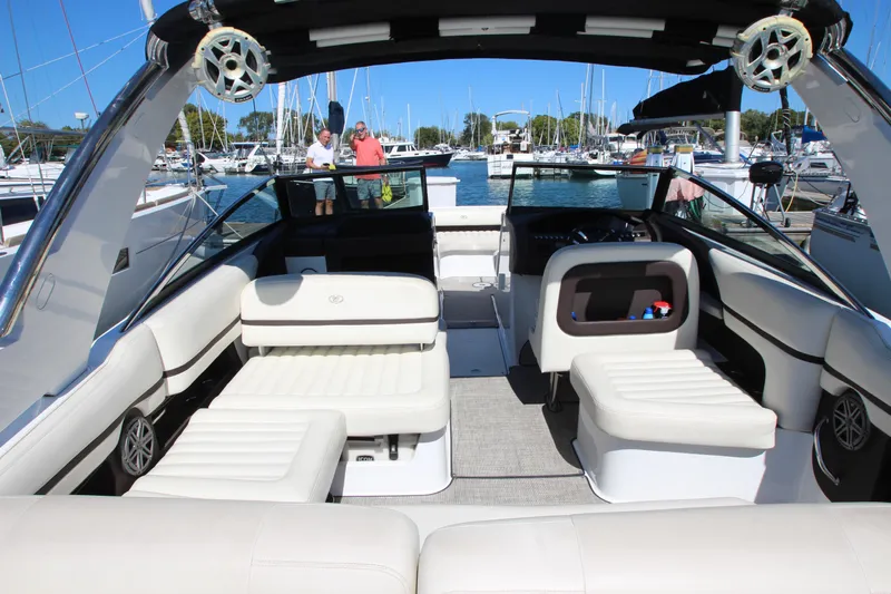  Yacht Photos Pics 2016 Cobalt R30 boat interior with white seating, docked at marina.