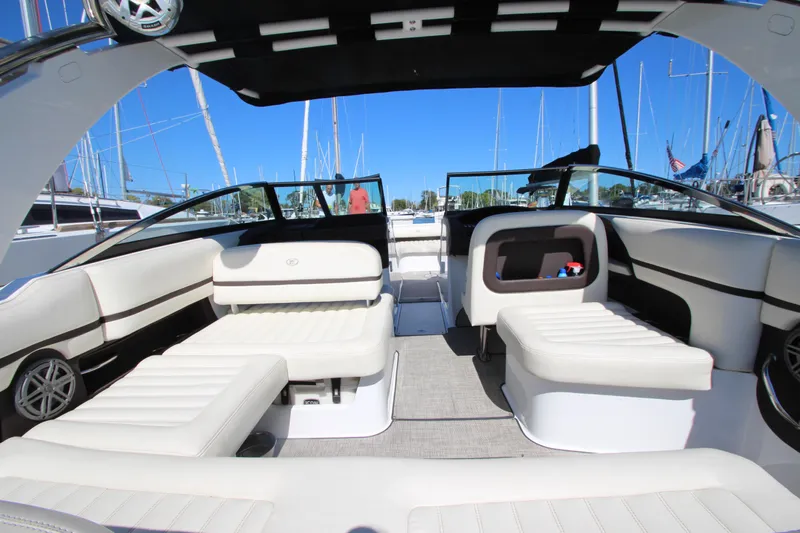  Yacht Photos Pics 2016 Cobalt R30 boat interior with white seating and open deck, docked at marina.