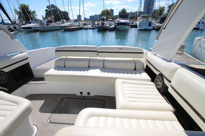  Yacht Photos Pics Luxurious 2016 Cobalt R30 boat interior with plush seating, docked at a marina.