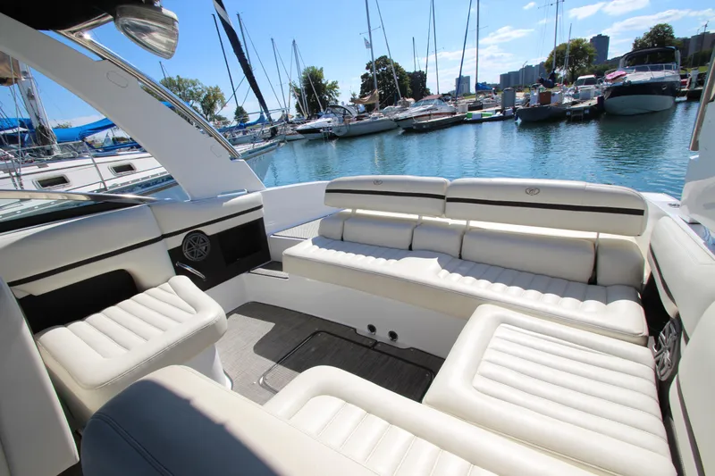  Yacht Photos Pics Luxurious 2016 Cobalt R30 boat interior with white seating, docked at a marina.
